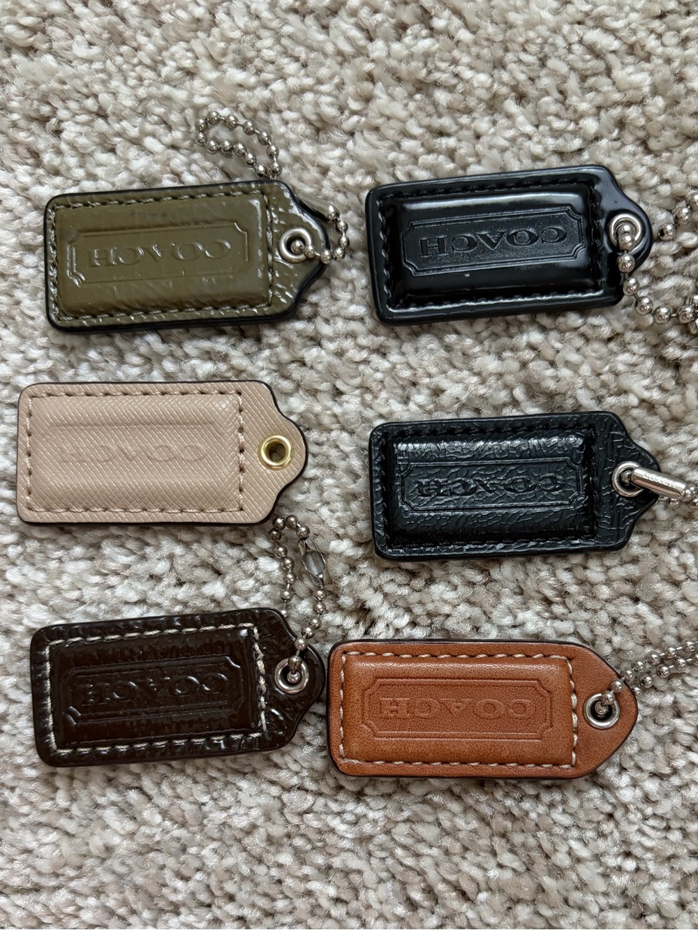 Coach Leather Key Tag Set in Olive, Black, Cream, Dark Brown, and Tan